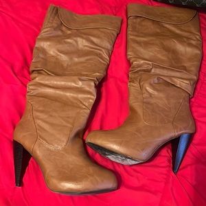 Brown pleather below the knee boots.